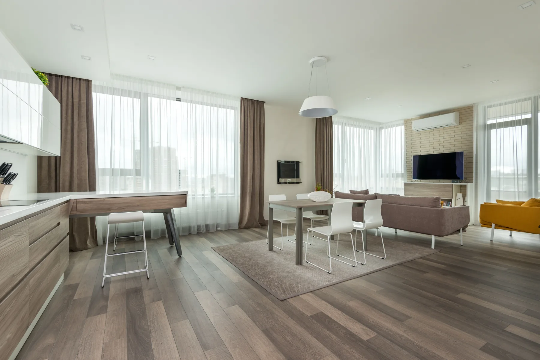 Luxury vinyl plank flooring across an open living space